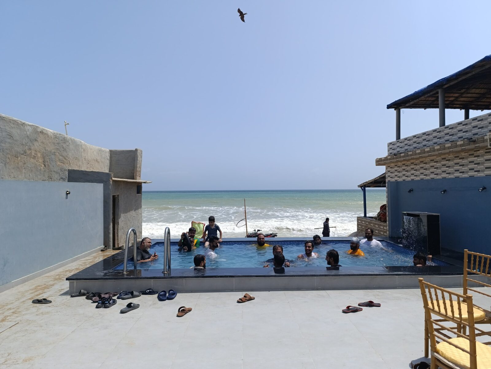 Deliverydevs picnic 2024: the beach house and its pool looking out to the sea