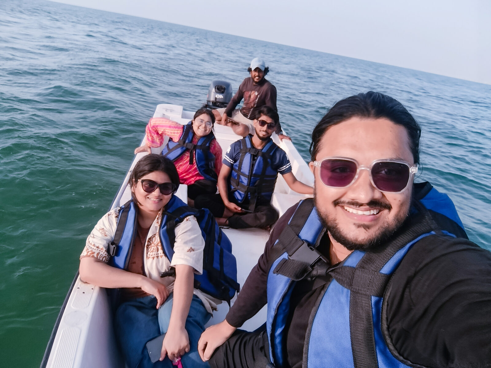 Deliverydevs picnic 2025: the team out on a boat ride in life jackets