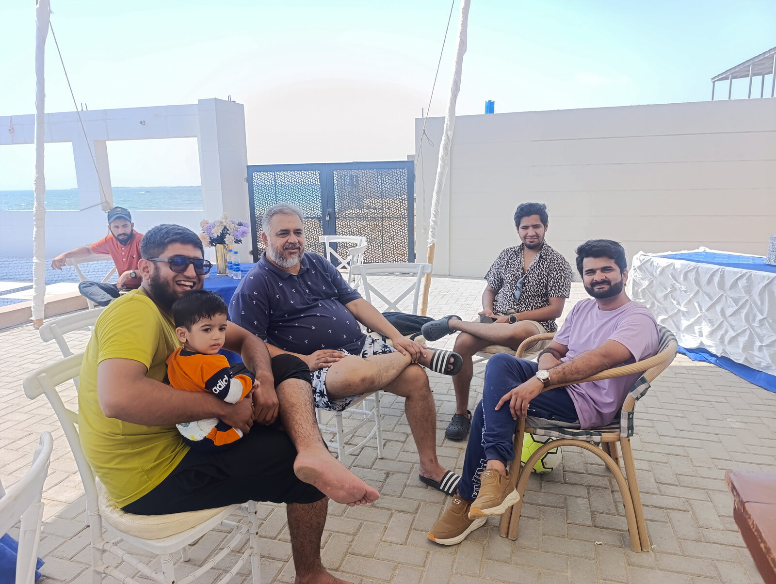 Deliverydevs picnic 2025: the team relaxing at the beach club